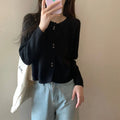 Women's long-sleeved acrylic cardigan sweater in five colour options with regular sleeve design