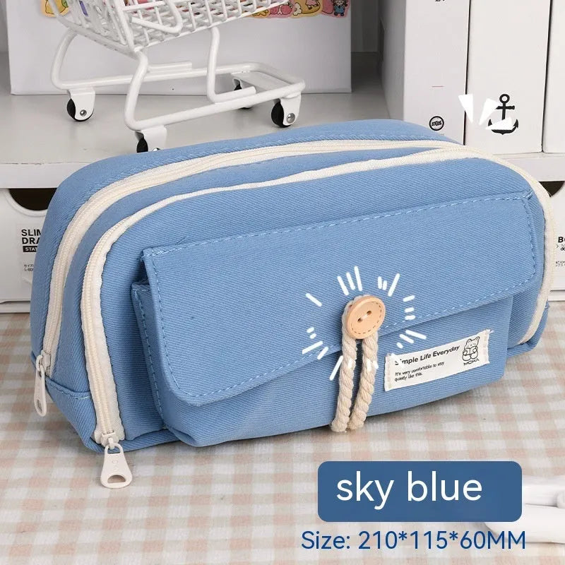 Large Korean-style canvas pencil case for girls in green, holding multiple pens.