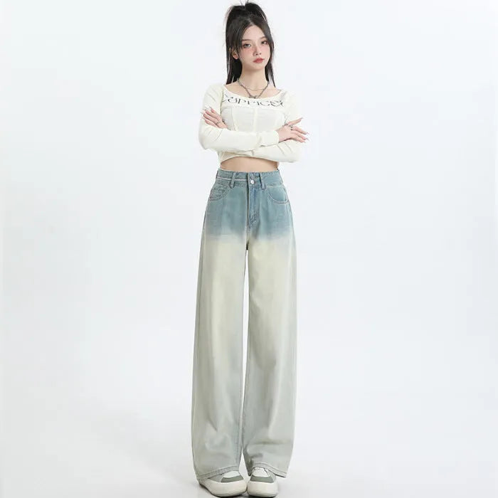 Gradient blue women's straight-leg denim trousers showing colour variation from light to dark blue tones