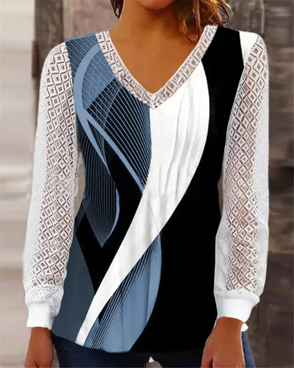 Purple loose V-neck women's top with a white hollow-out lace print pattern and long sleeves.