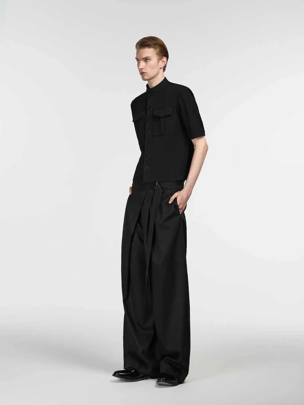 Black women's straight-leg trousers with single pleat front and adjustable waistband