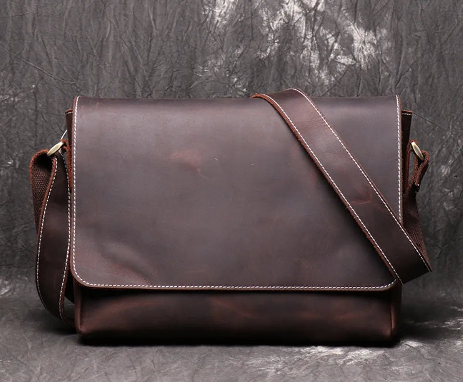 Men's vintage brown leather messenger bag with organised interior compartments and crossbody strap