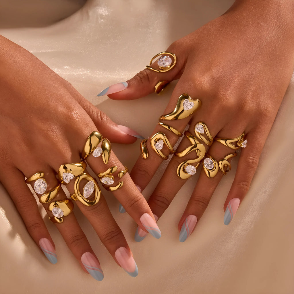 Women's geometric zircon ring with adjustable open mouth design on a hand.
