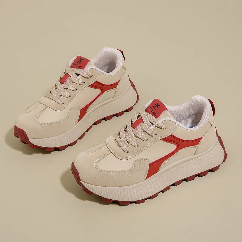Women's low-top sports running shoes with mesh lining and front lace-up closure in solid colour options
