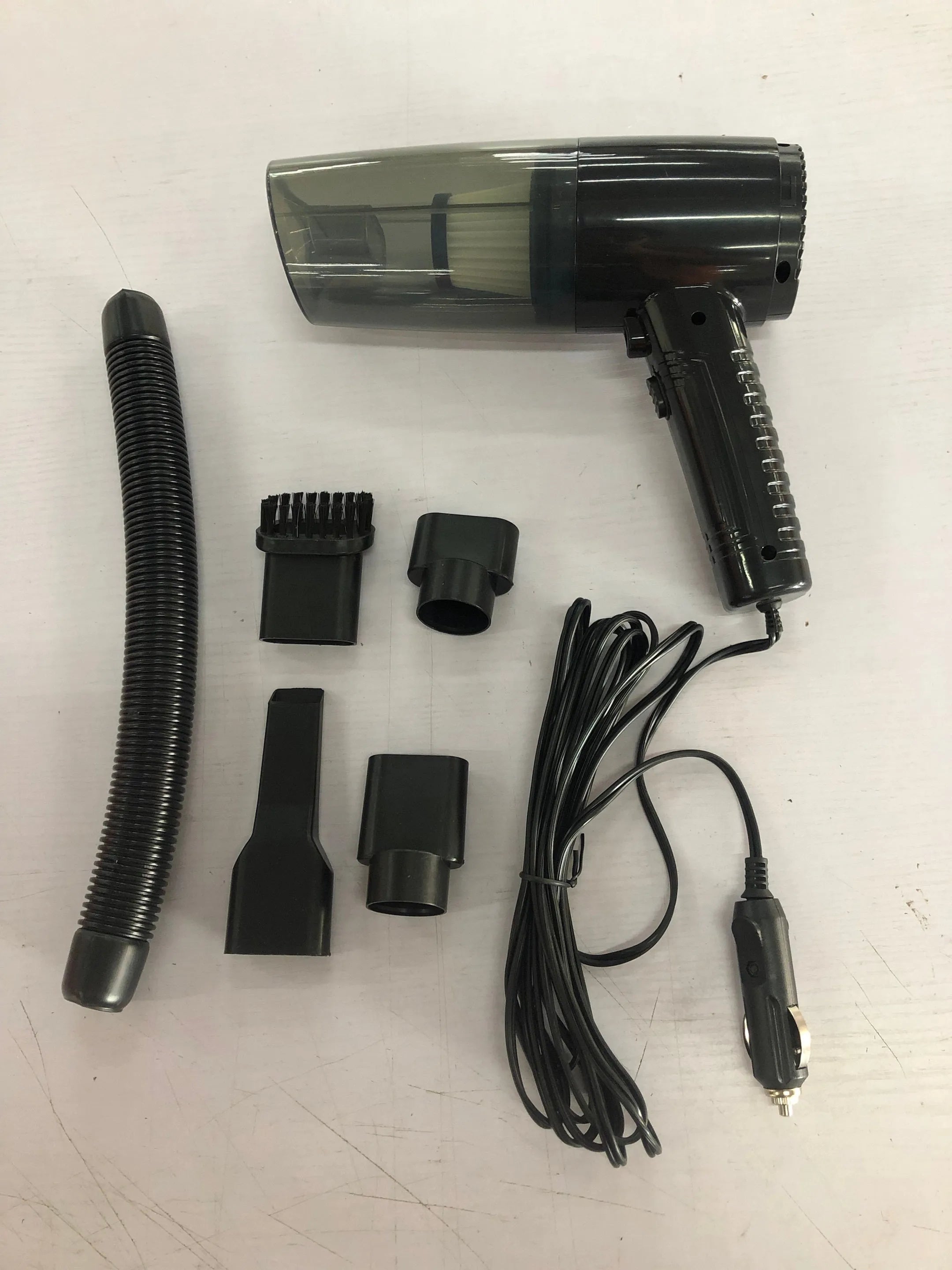 12V car vacuum cleaner with 4500Pa suction power and multiple suction head accessories in black or white colour options