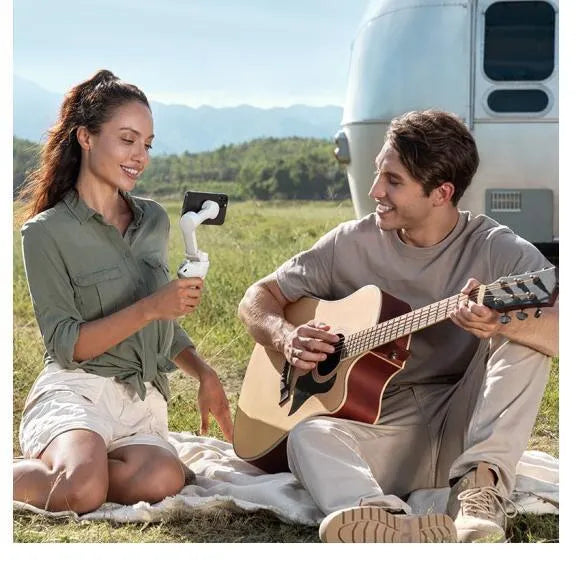 Magnetic mobile phone PTZ gimbal with integrated power bank, shown in a standard style.
