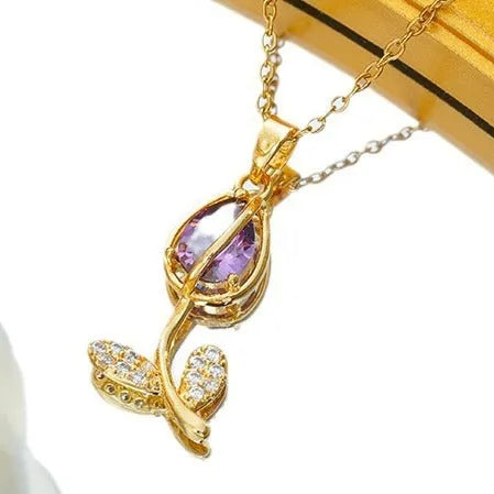 Gold zircon tulip flower pendant necklace on an adjustable titanium steel chain.