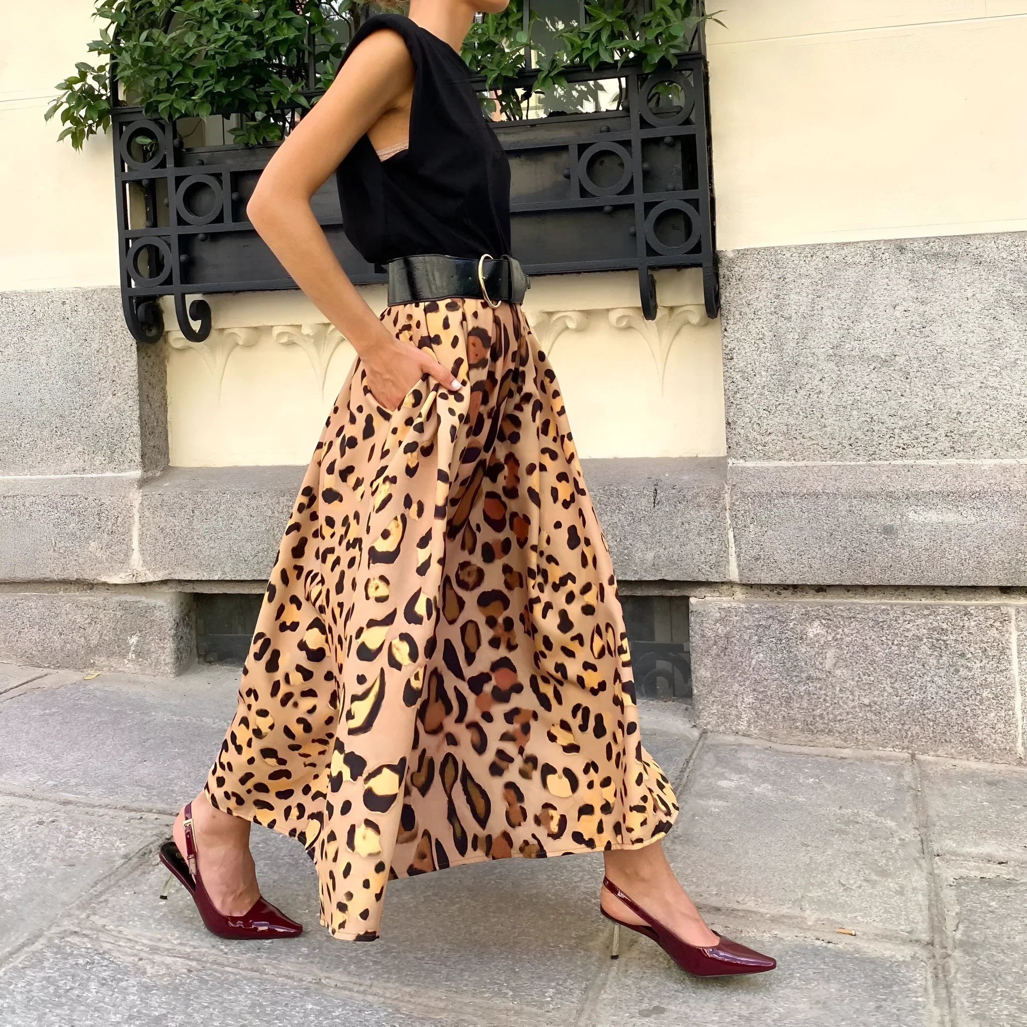 Brown leopard print women's long A-line skirt with a big hem.