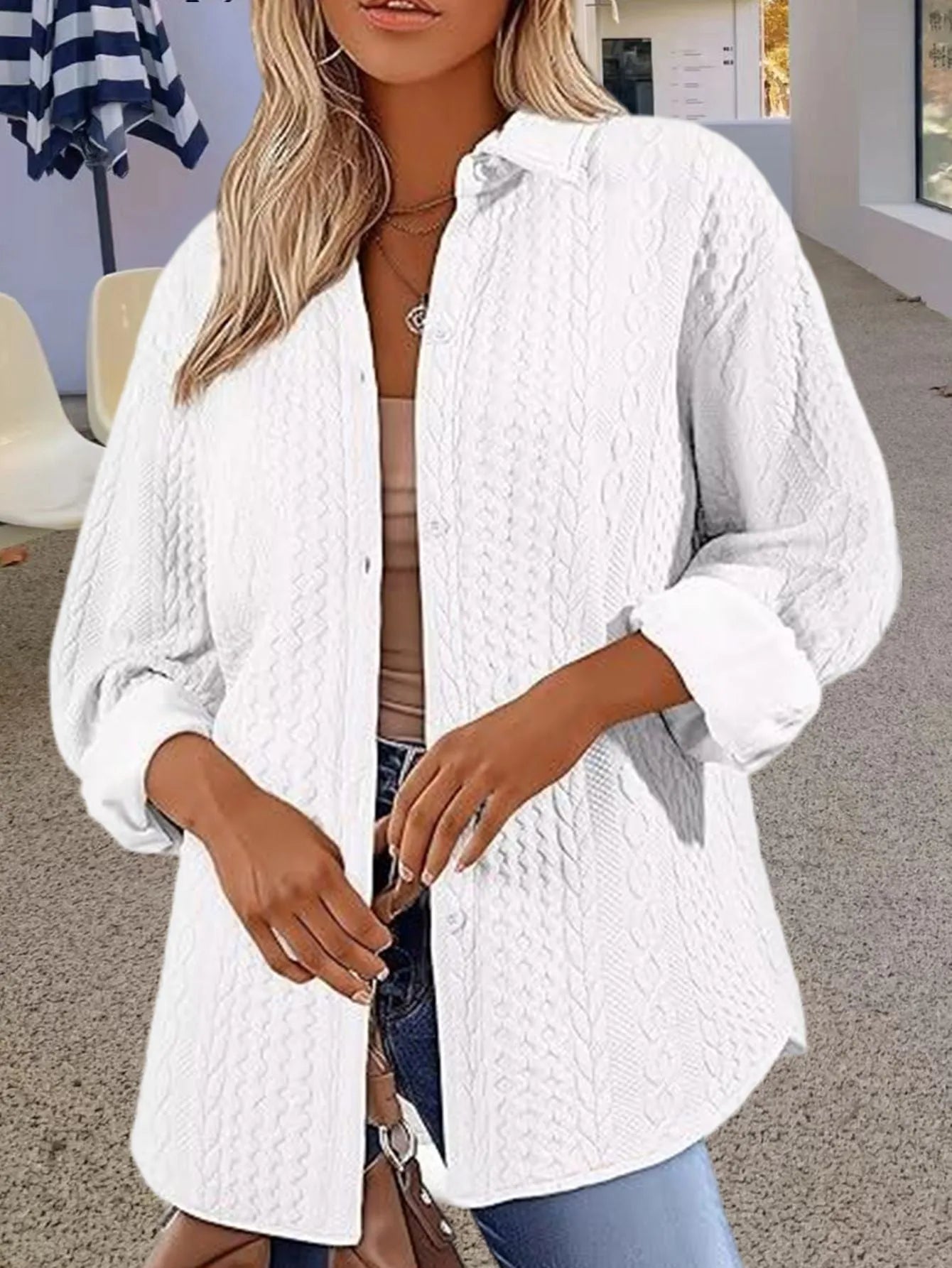 Women's solid colour long-sleeved knit cardigan in black, shown open as a layering piece.