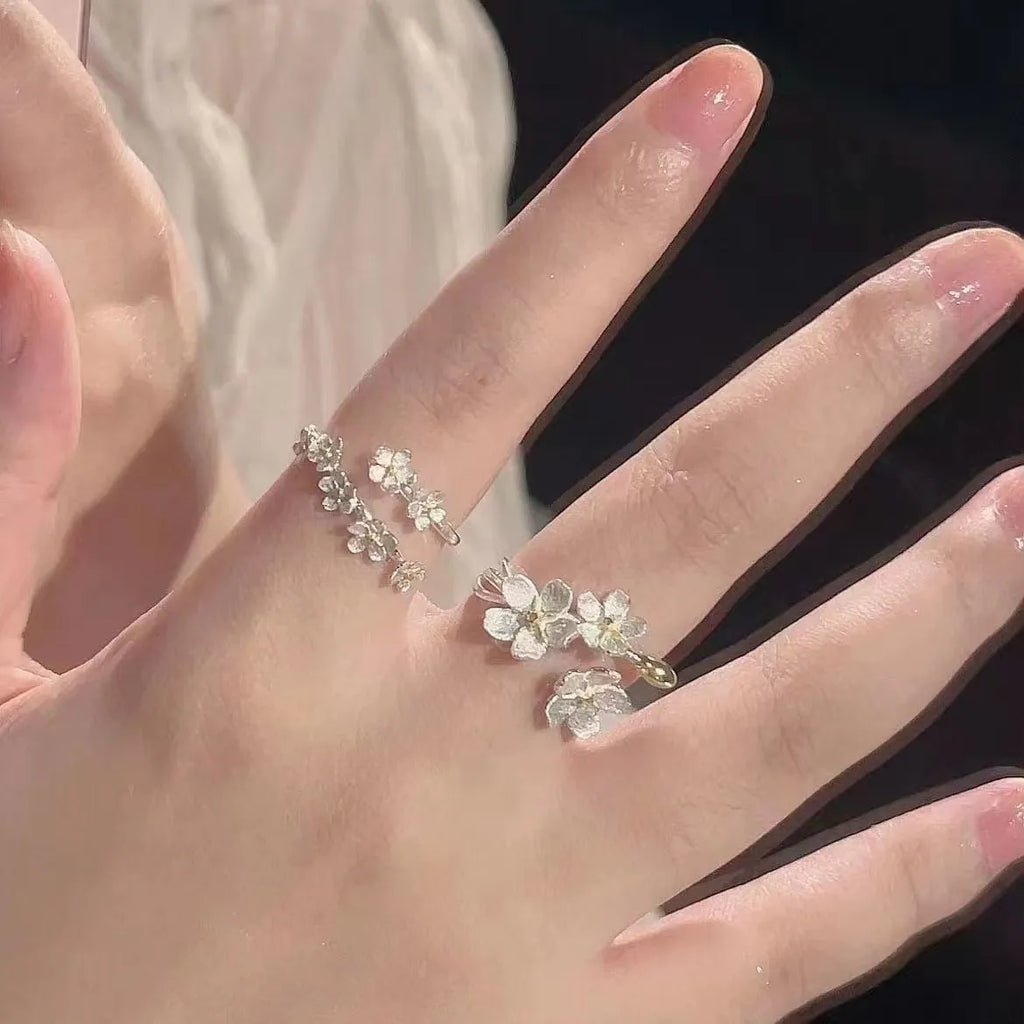 3D floral jasmine ring with heart, drop, and bell patterns on an adjustable open band.