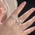 3D floral jasmine ring with heart, drop, and bell patterns on an adjustable open band.