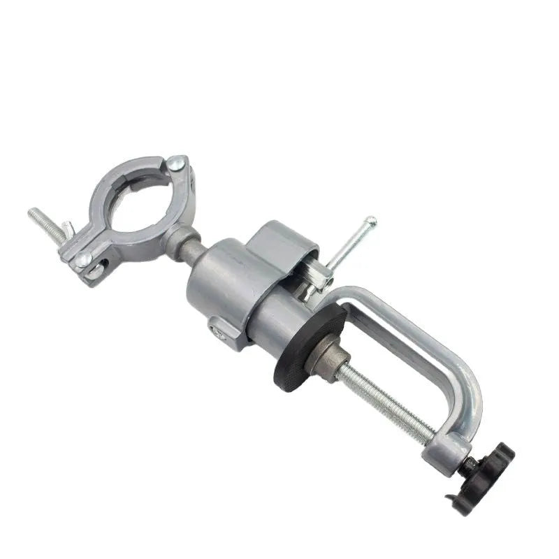 360 rotating clamp-on bench vise with tungsten steel construction mounted on workbench edge