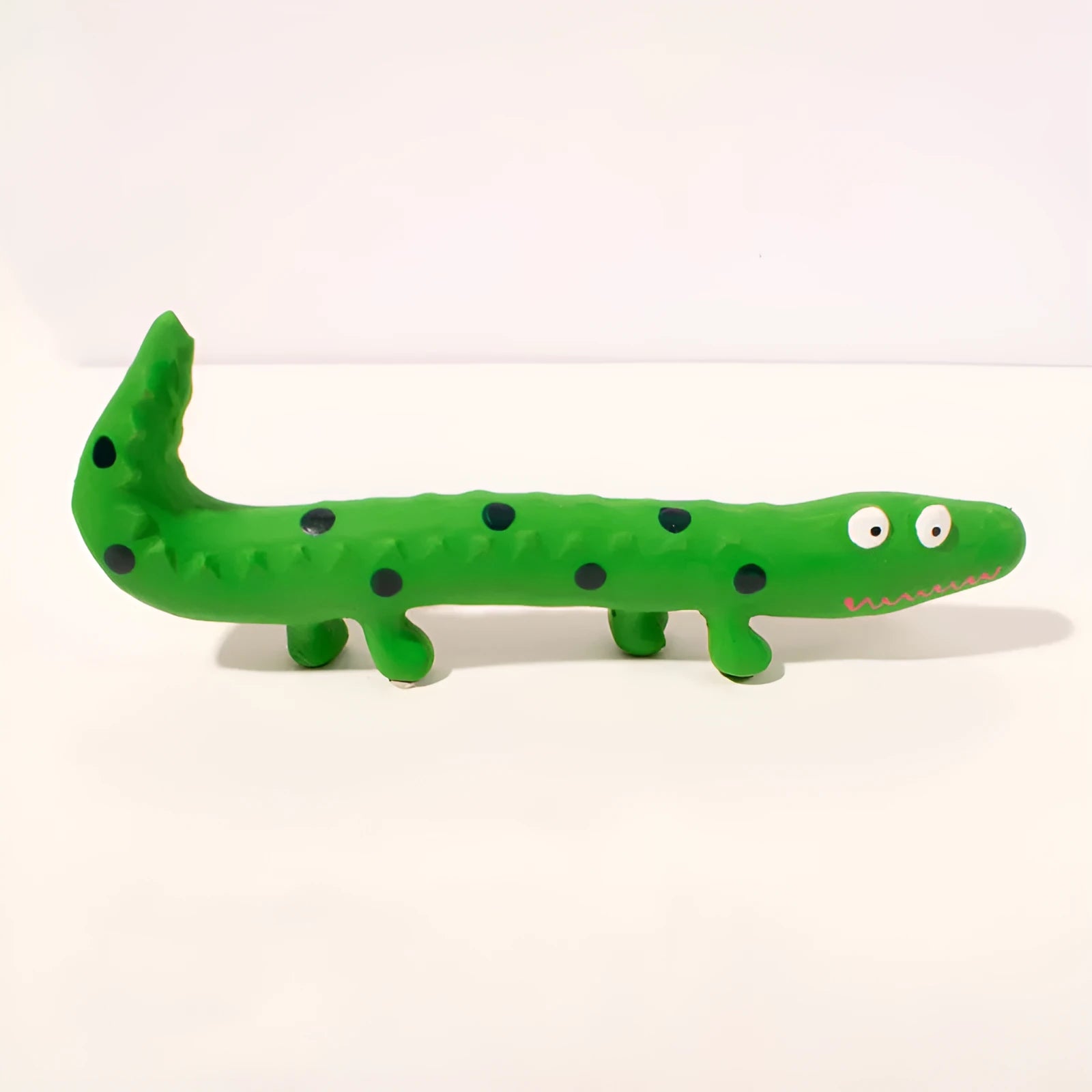 Green cartoon lizard shaped latex dog chew toy with squeaker for aggressive chewers