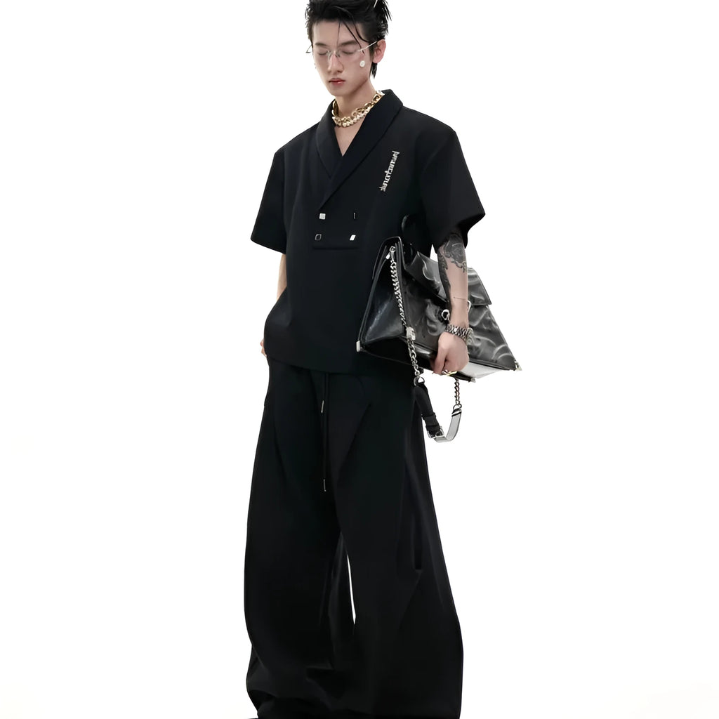 Men's dark grey cotton sports suit with V-neck jacket, padded shoulders, metal embellishments and matching shorts