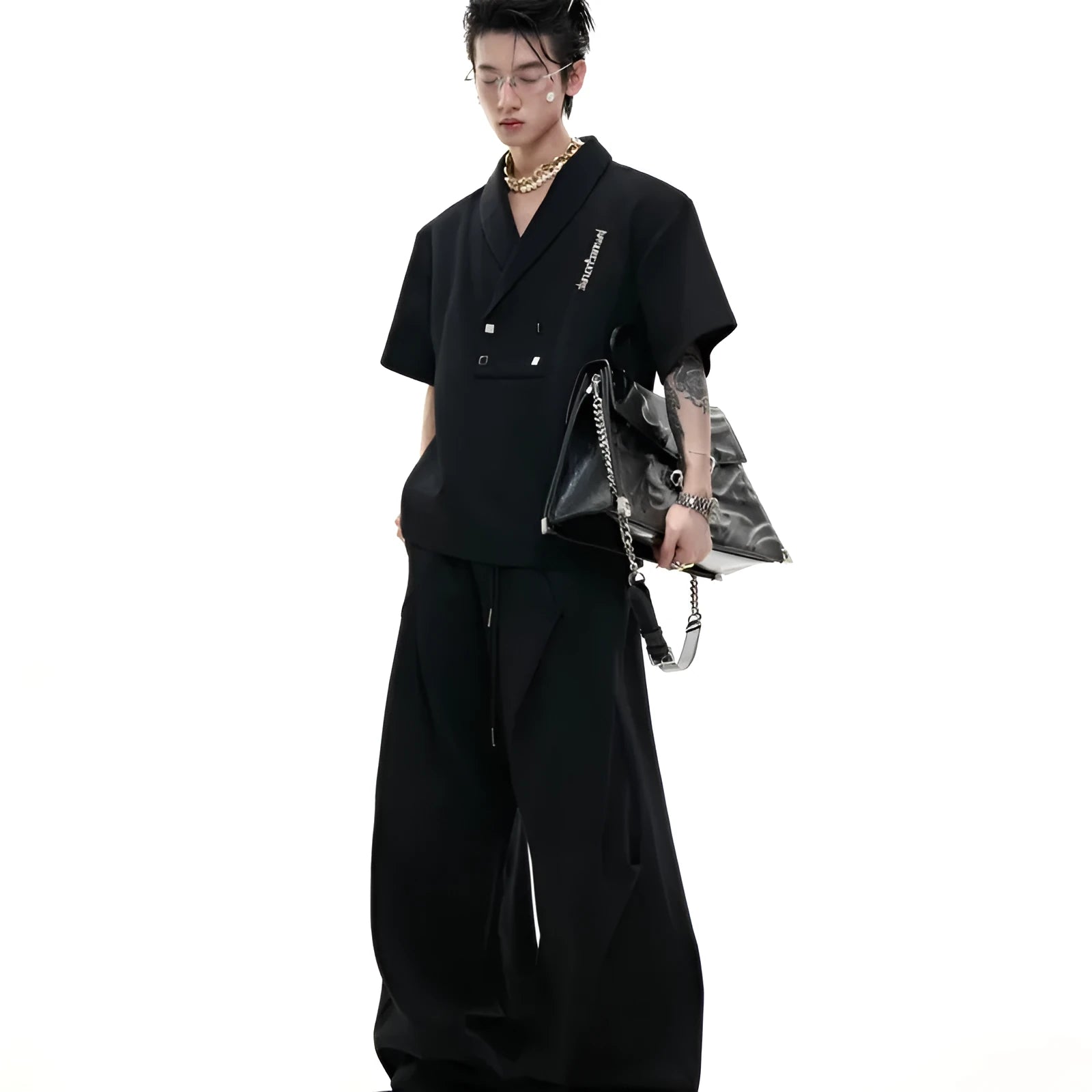 Men's dark grey cotton sports suit with V-neck jacket, padded shoulders, metal embellishments and matching shorts