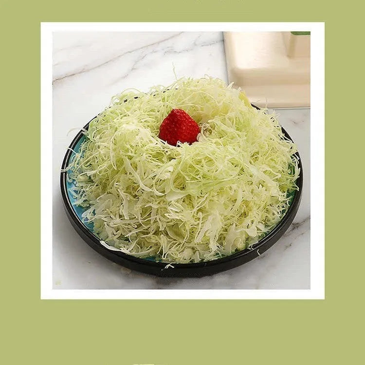Beige stainless steel multifunctional vegetable slicer chopper and grater kitchen tool.