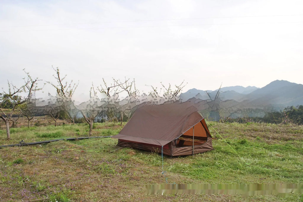 Brown or white A-line cabin tent pitched with trekking poles, showing spacious interior and waterproof fabric construction