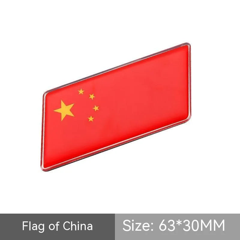 Aluminium metal car sticker with national flag design in a parallelogram shape.
