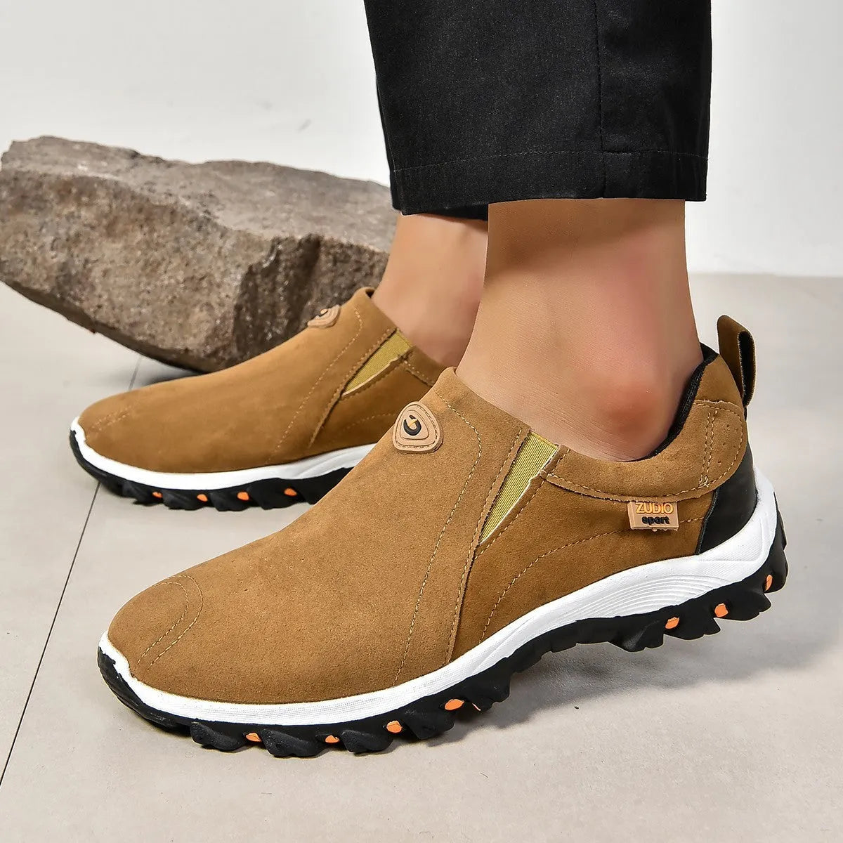 Men's thin slip-on overshoe covers in grey, blue, light brown, green, and black colours on a rubber sole.