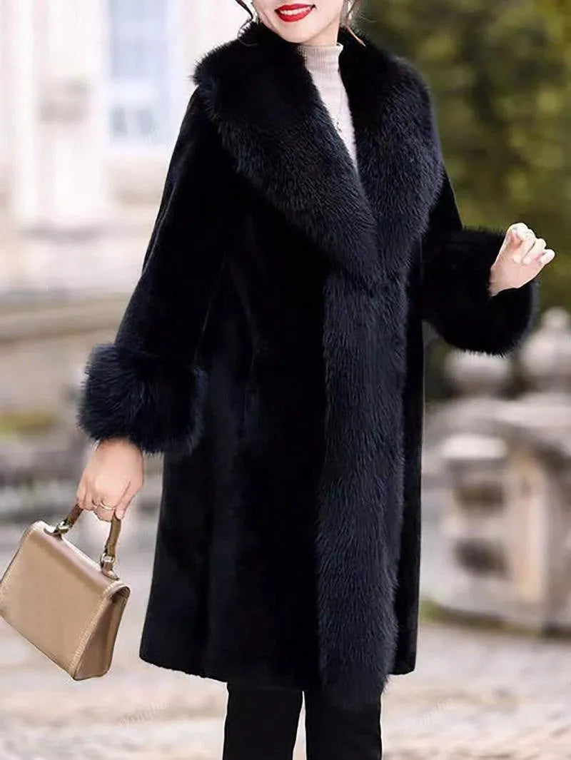 Grey women's thick faux rabbit fur mid-length coat with a fur collar on a hanger.