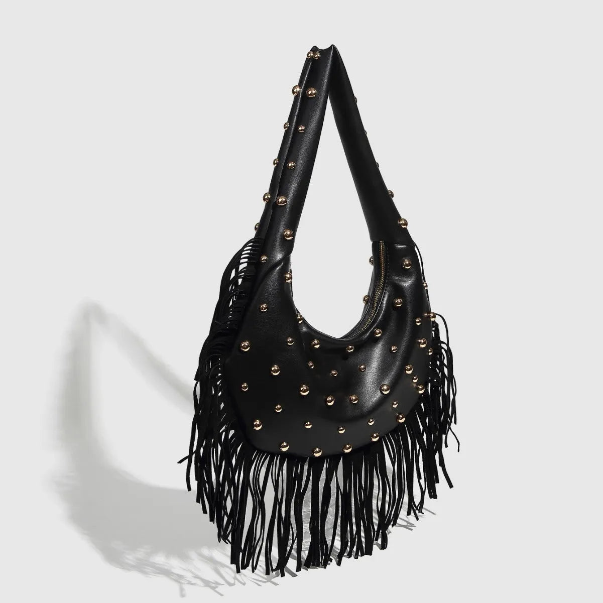Retro tassel shoulder handbag in black or wine red showing integrated phone compartment and structured design