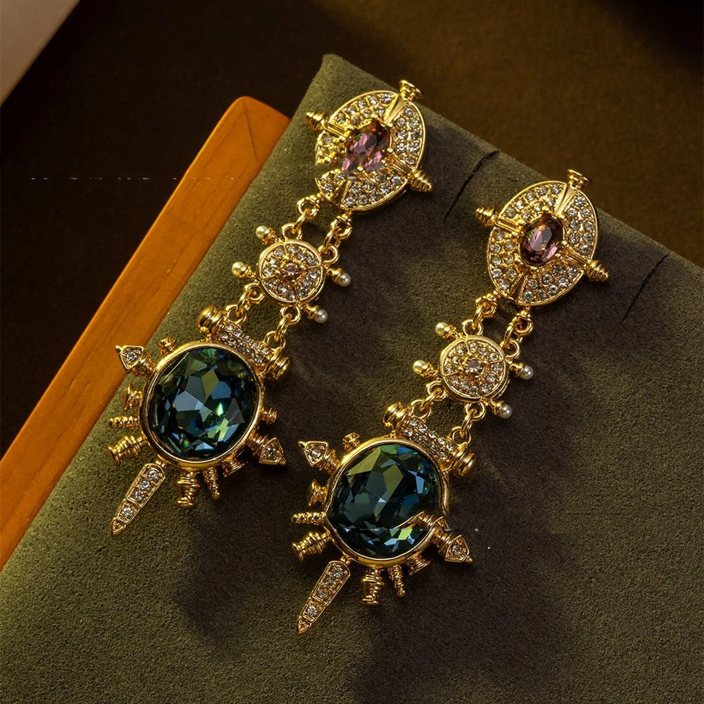 Gold alloy retro geometry stud earrings with round shape and diamond treatment.