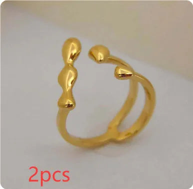Women's brass opening ring with gold finish and circle sphere design