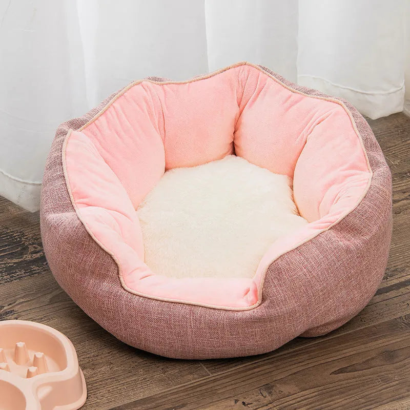 Blue octagonal pet sofa bed with a removable central mat for a small dog or cat.