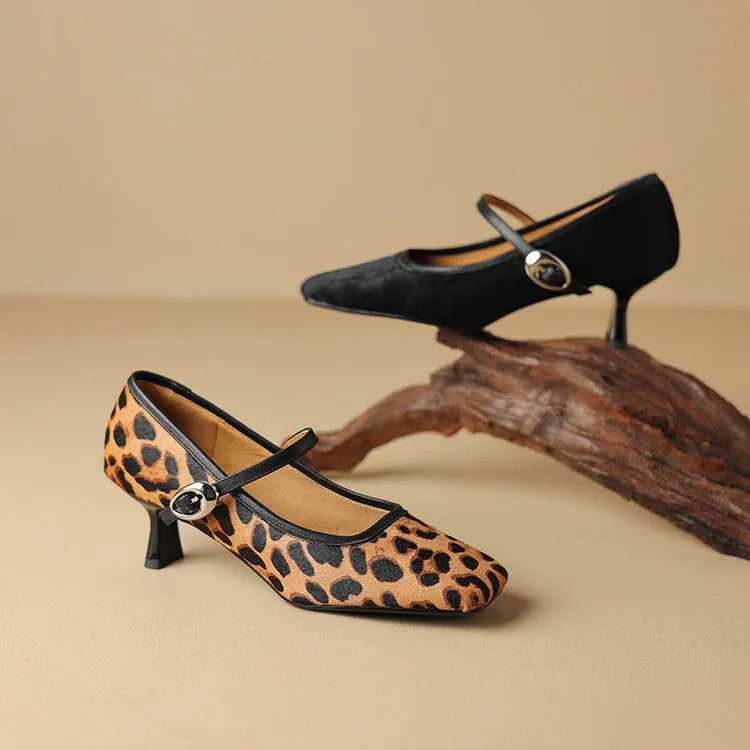 Women's black square toe stiletto heel ankle-strap shoes with horse hair upper.