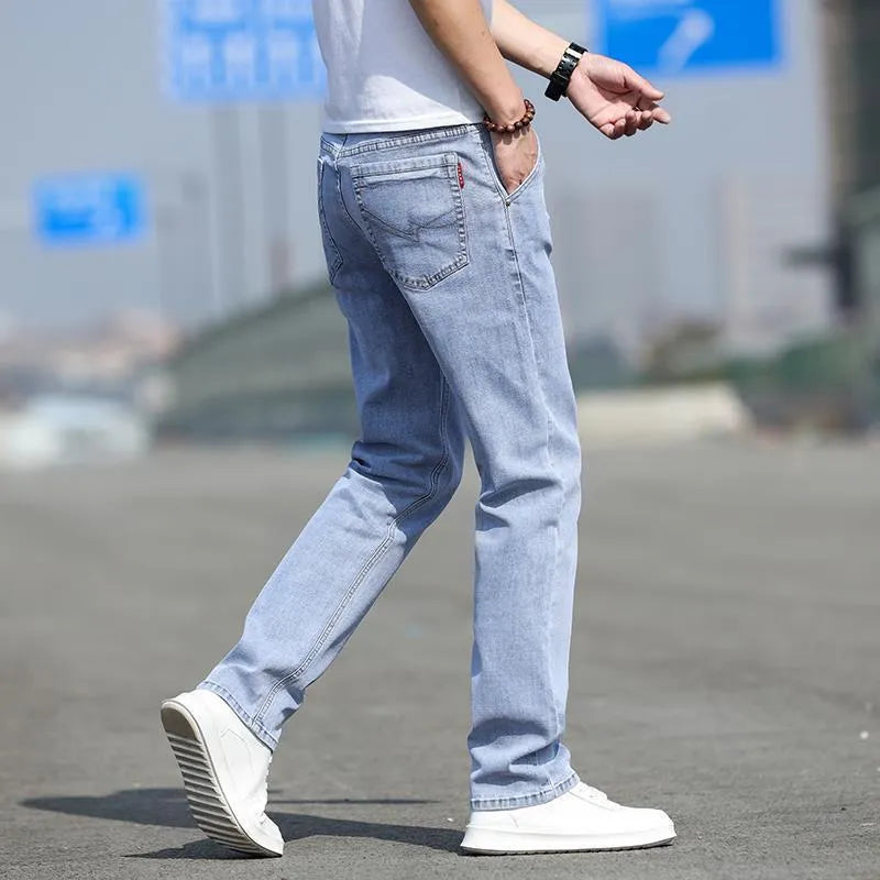 Men's smoky gray jeans with straight leg cut and rabbit fur fabric showing zip fly closure