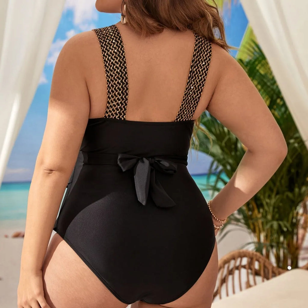 Women's black one-piece sleeveless swimsuit with chest pad on a mannequin, shown in an extended size.
