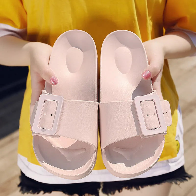Women's grey blue flip-flop slippers with a single buckle and soft EVA sole.