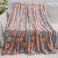 Cartoon style flannel child blanket shown covering an air conditioner, available in multiple colours.