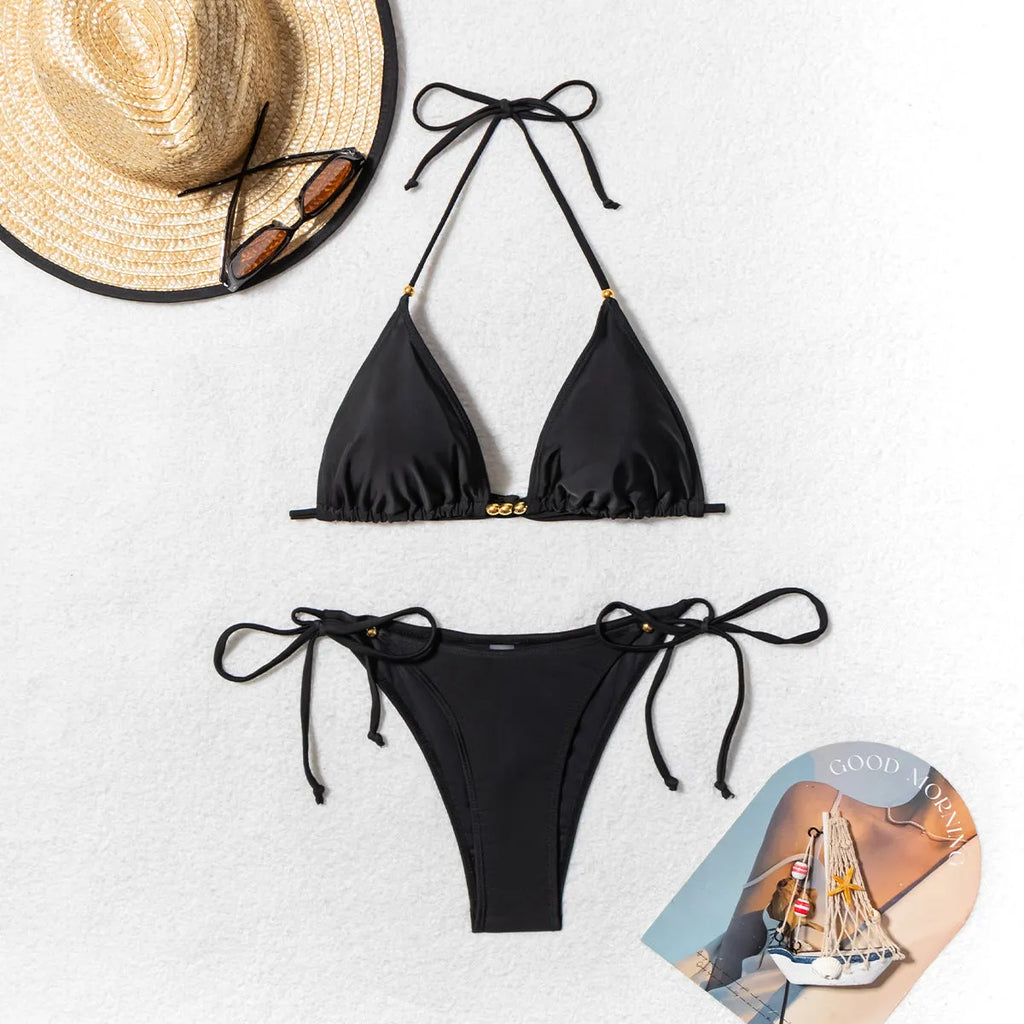 Black women's bikini swimsuit with metal bead detailing on side-split bottoms