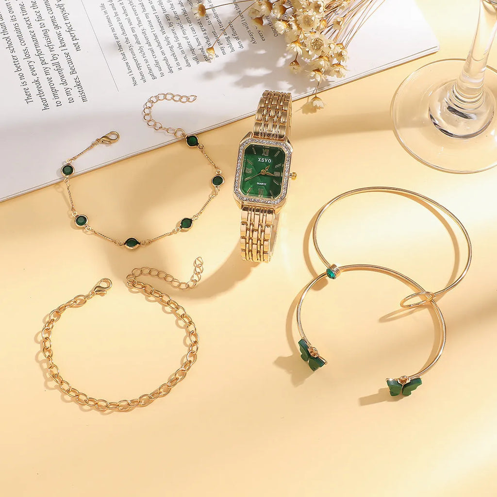 Gold green square women's watch with matching butterfly bracelets on wrist