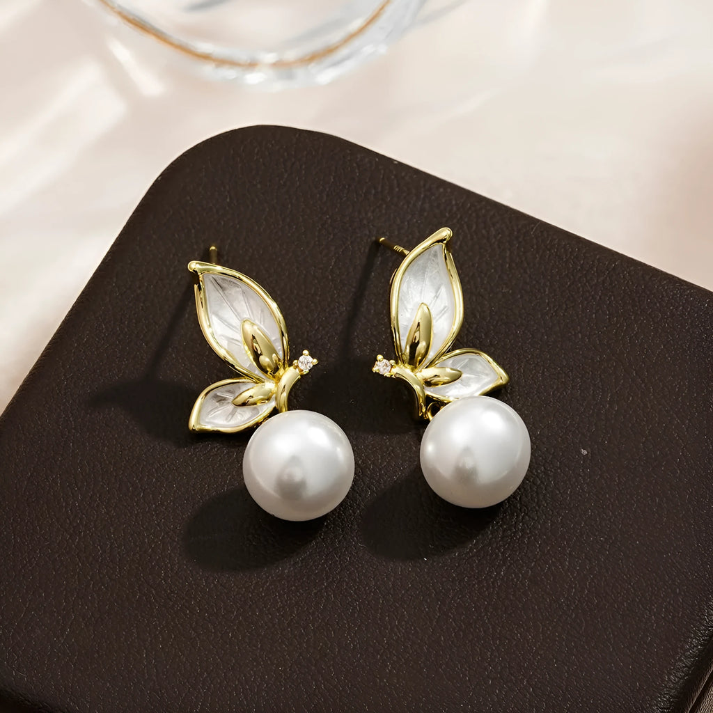 Gold-tone butterfly earrings with zircon painting detail on copper wings