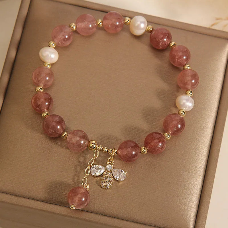 Women's freshwater pearl and strawberry quartz bracelet with zircon details on alloy chain