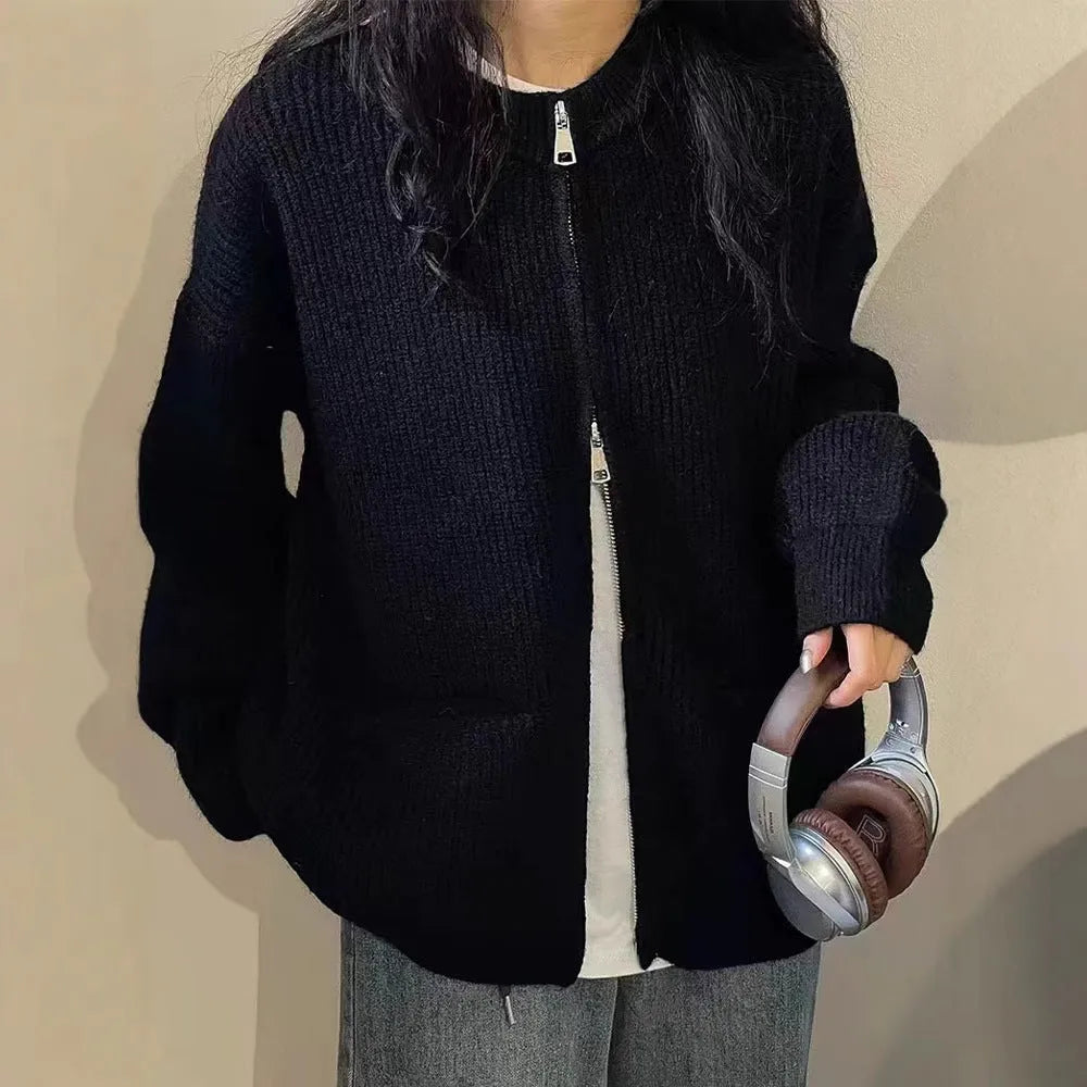Beige viscose knit cardigan coat with long sleeves on a hanger.