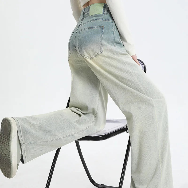Gradient blue women's straight-leg denim trousers showing colour variation from light to dark blue tones