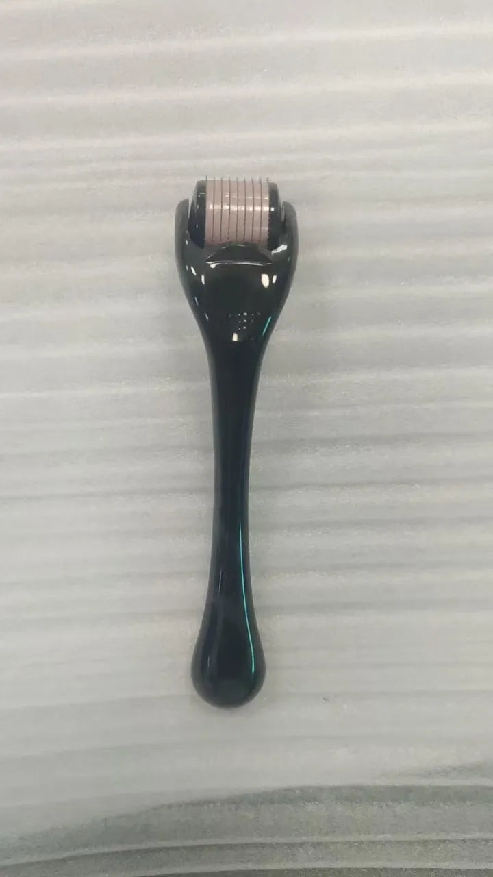Black handle micro needle roller with purple wheel showing 540 stainless steel needles for dermaplaning