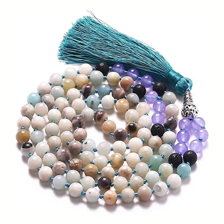 Long agate tassel necklace with geometric stone beads in various colours on a neutral background.