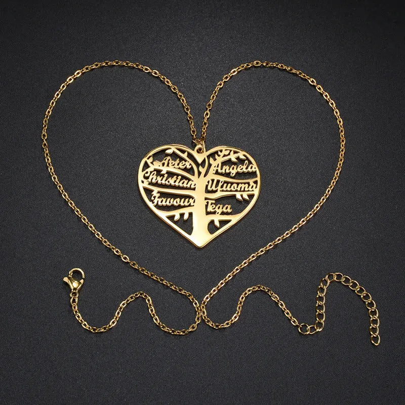 Women's custom name necklace with stainless steel heart and tree pendant on a chain.