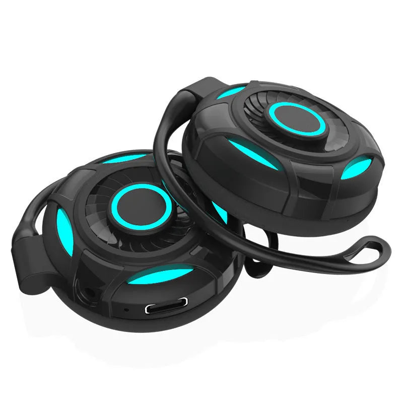 Black wireless Bluetooth gaming earphones with hanging ear design and USB charging cable