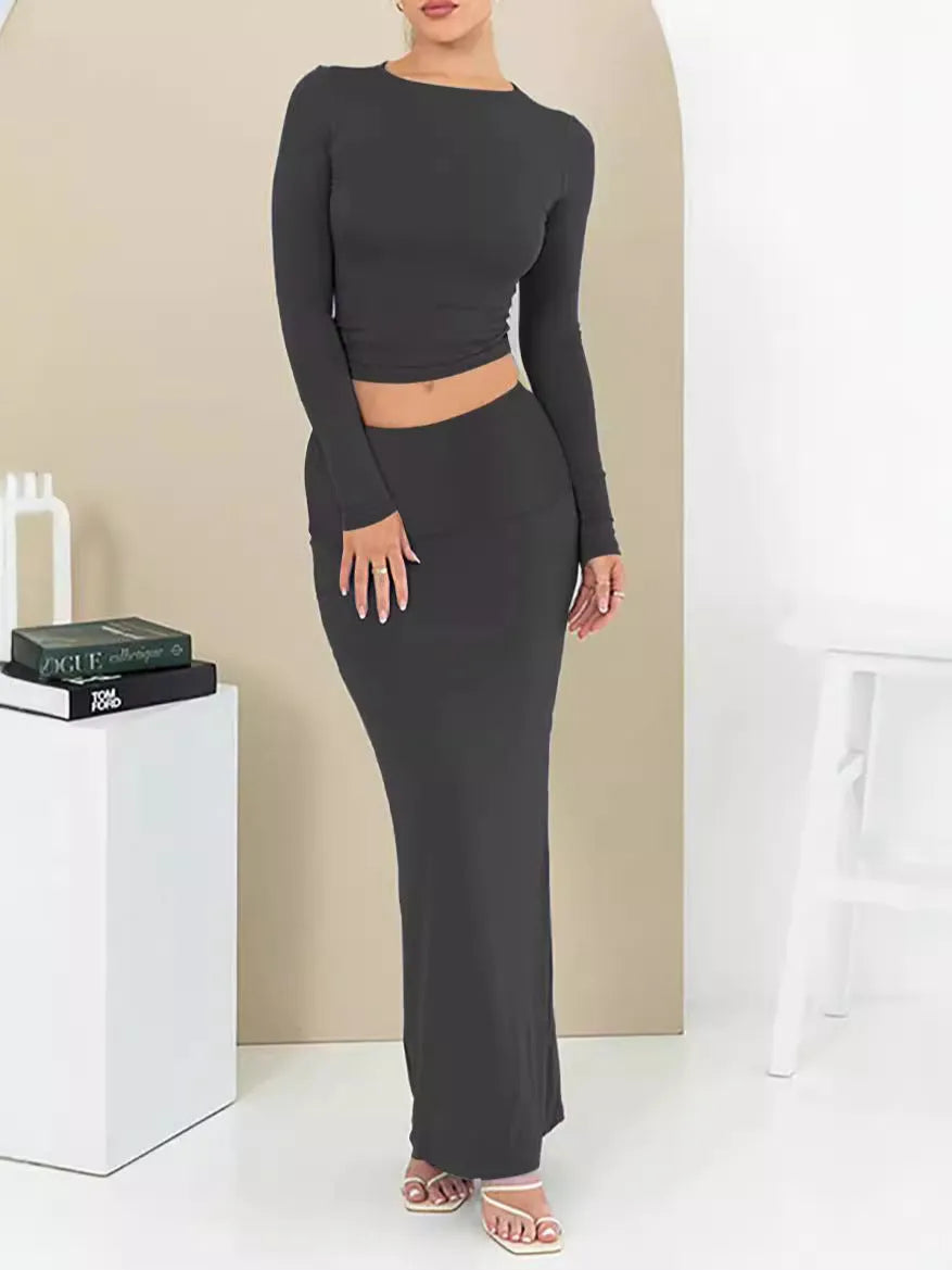 Women's sweet style two-piece suit set with long skirt and three-quarter sleeves in solid colour.