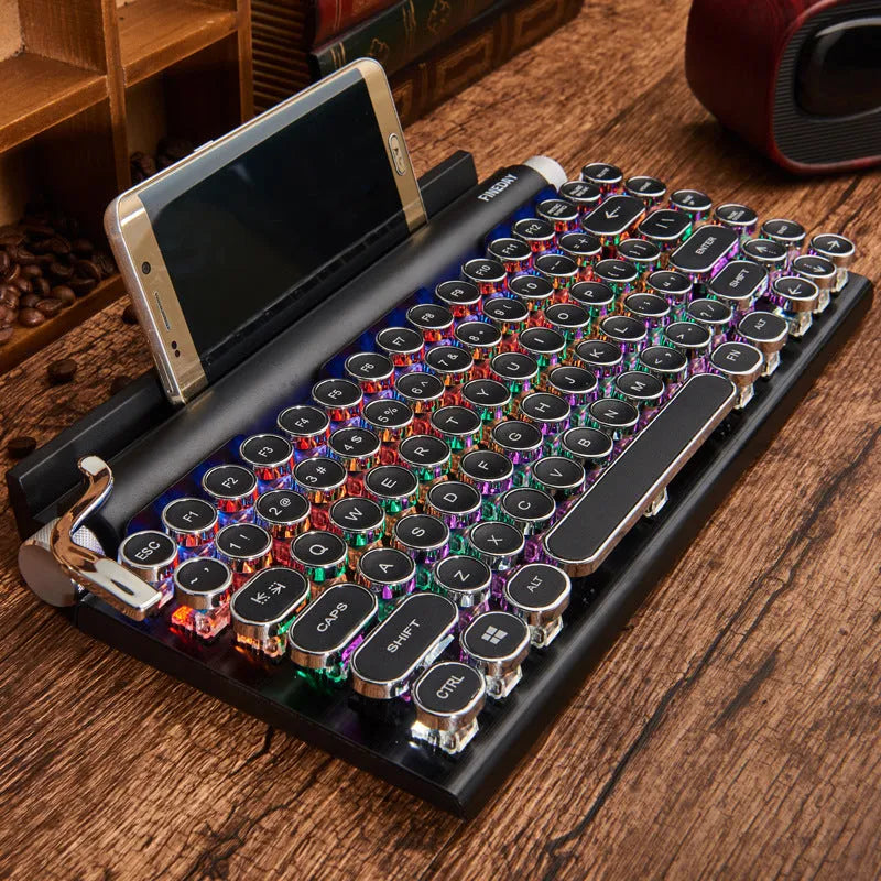 Black Dot Retro mechanical keyboard with colourful backlit keys on a desk.