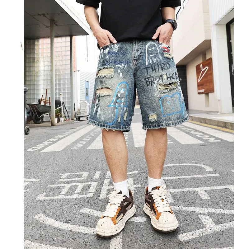 Blue ripped men's denim jeans shorts with a zip fly and straight-leg opening.