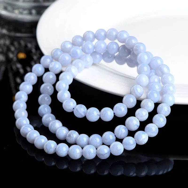 Blue agate bracelet with natural striped patterns on 6-6.8 mm beads in unisex design