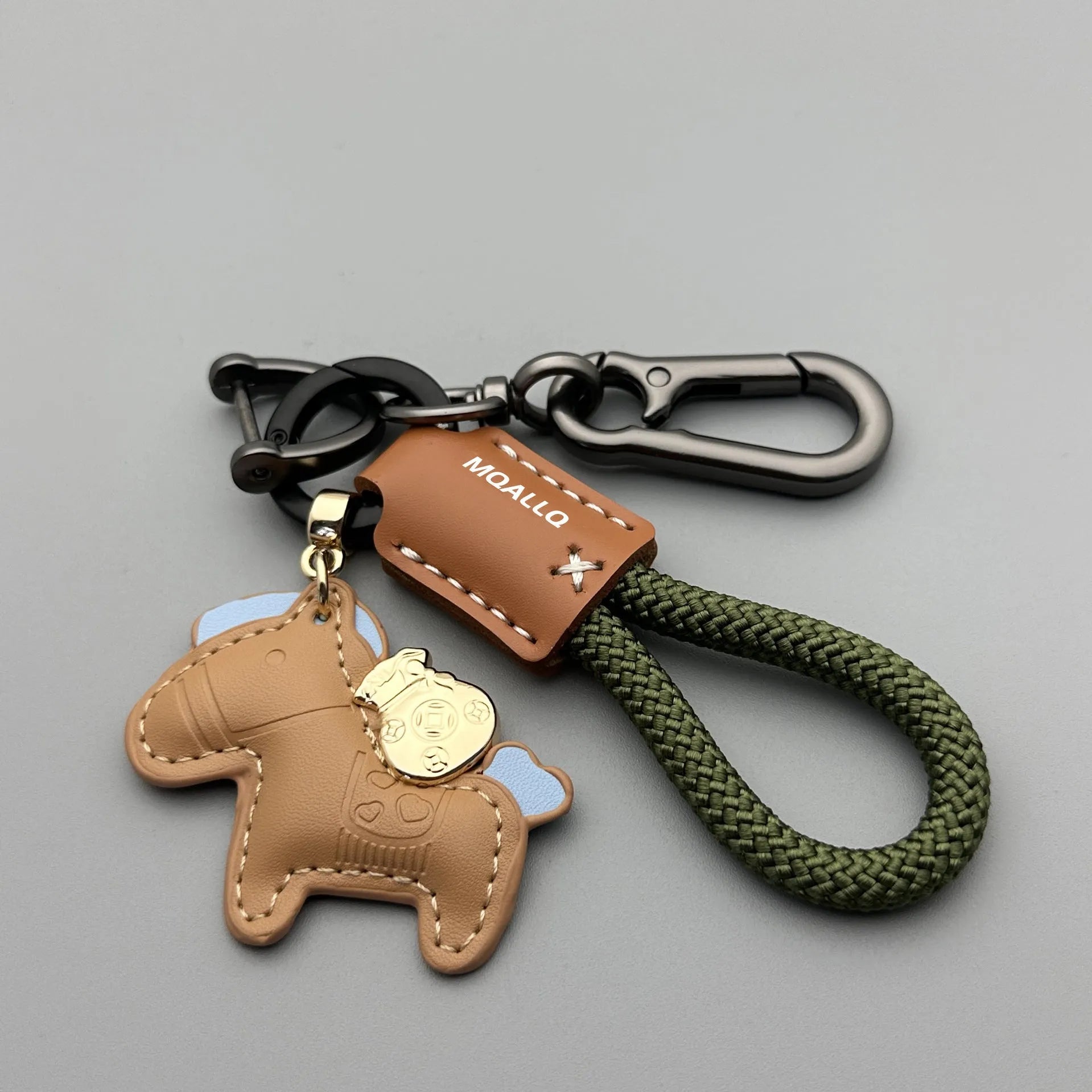 Handmade brown cowhide leather car key ring pendant with a zinc alloy belt buckle and green flanelle rope.
