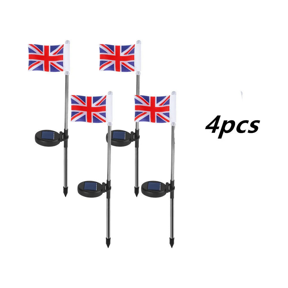 Solar garden flag light with stainless steel pole showing American flag design illuminated at night