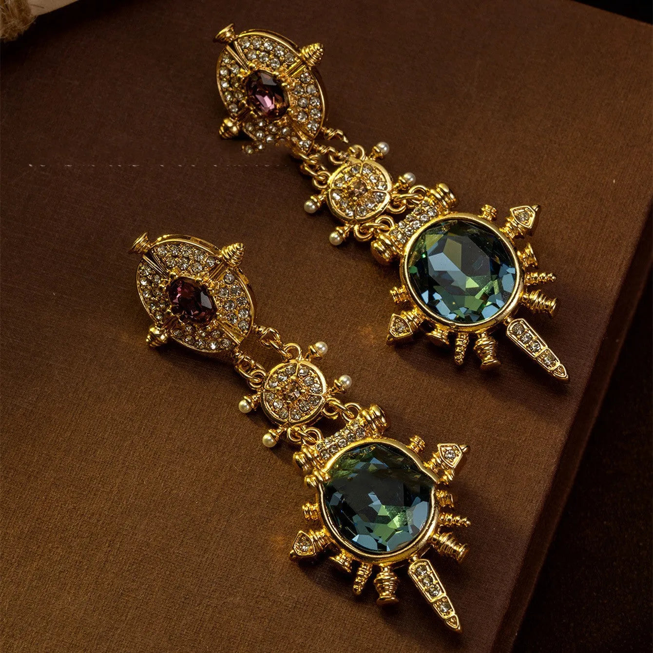 Gold alloy retro geometry stud earrings with round shape and diamond treatment.